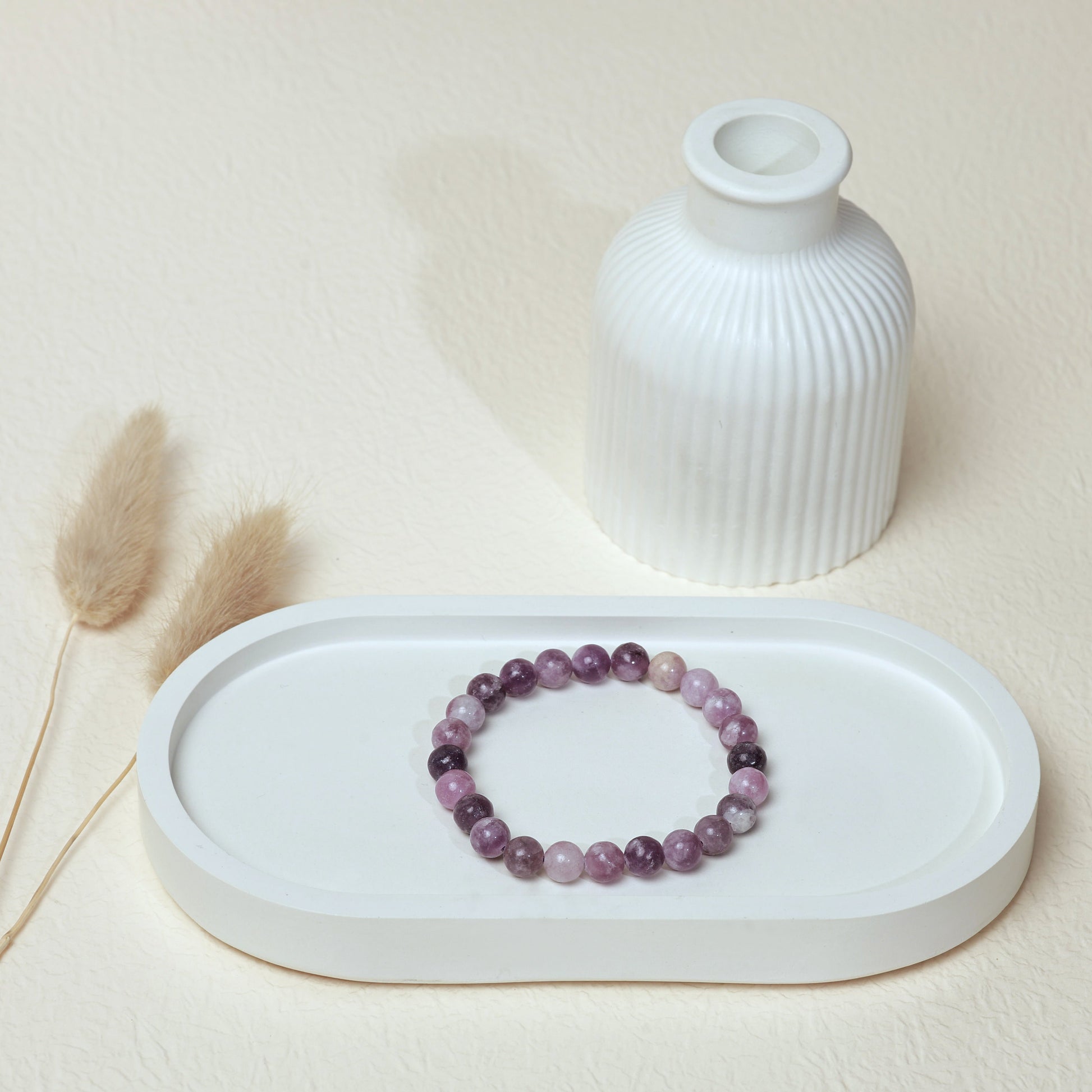 Lifestyle shot of Lepidolite bracelet, featuring the calming soft purple hues of the crystals.